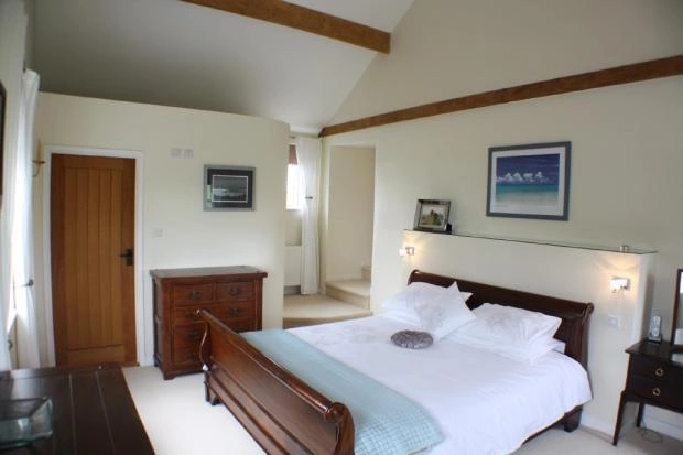 Bedroom with vaulted ceiling and exposed timber beams — AVA Building, Truro Cornwall