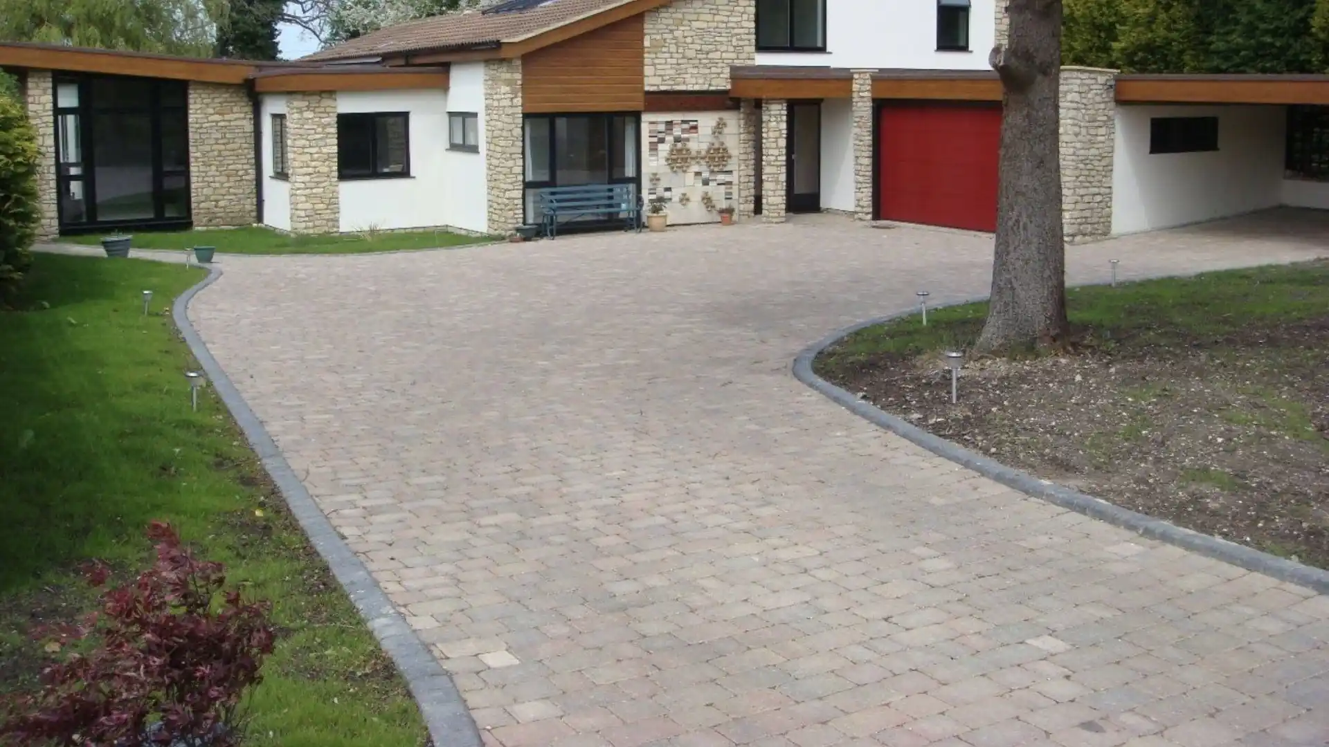 Block-paved driveway on a stone and timber detached house — AVA Building, Truro Cornwall
