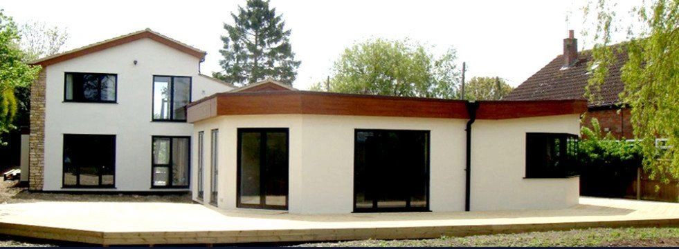 Contemporary white render house extension with large patio — AVA Building, Truro Cornwall