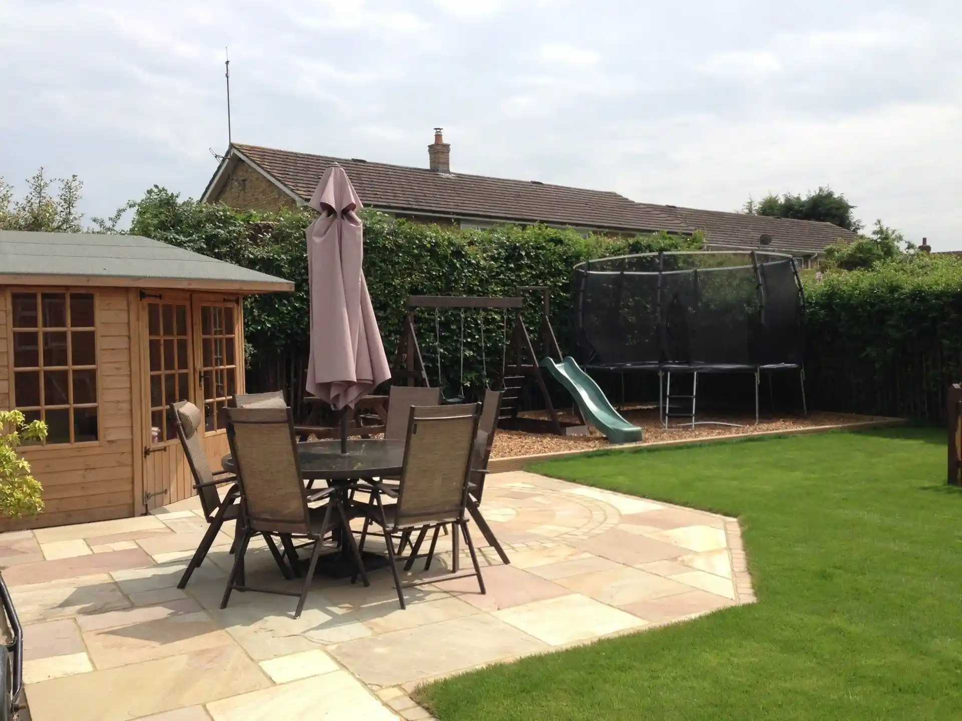 Family garden with patio, lawn, shed and play area — AVA Building, Truro Cornwall